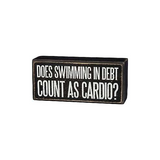 Primitives Swimming In Debt Box Sign